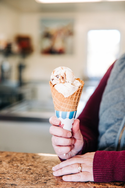 Red haired girl with an ice cream cone.